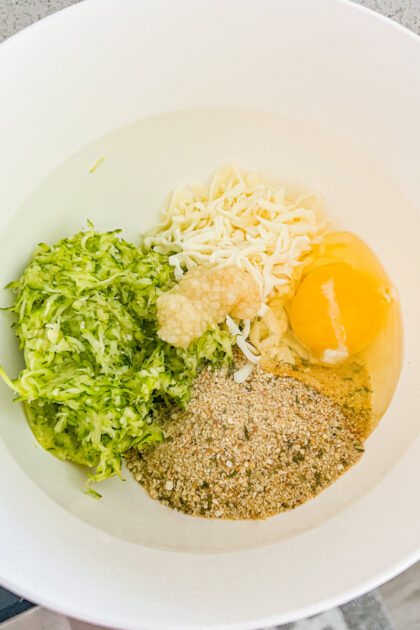 Zucchini Cake ingredients in a white bowl