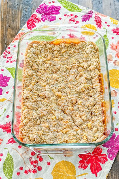 Golden caramel apple bars cooling in a baking pan