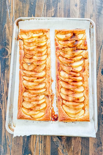 Overhead view of homemade apple tarts with golden pastry and baked apples fresh from the oven