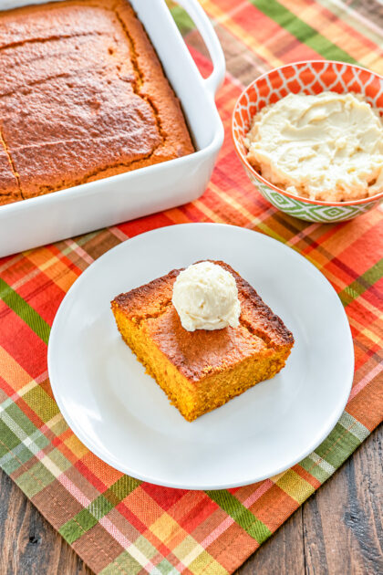 Scoop of soft whipped honey butter spread served on cornbread