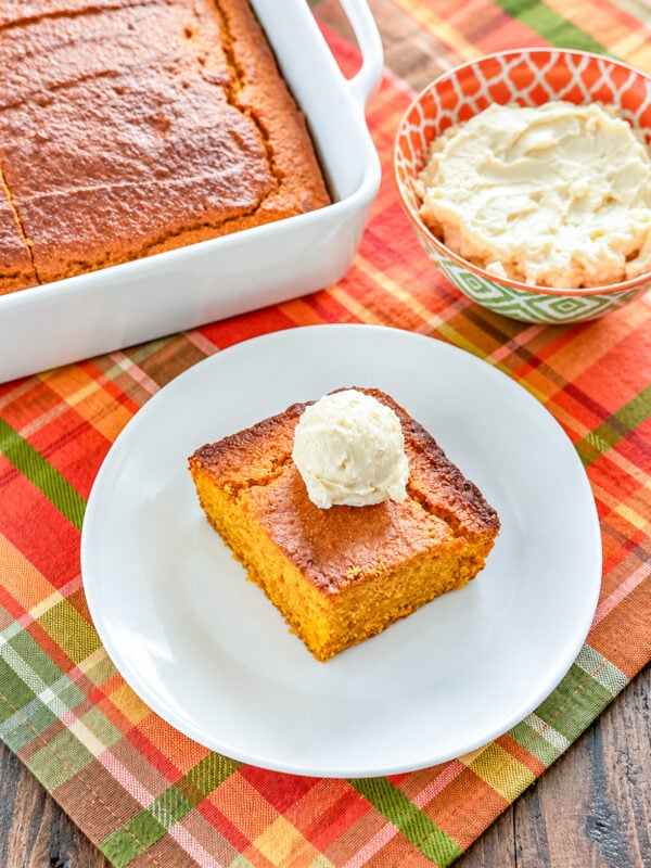 Scoop of soft whipped honey butter spread served on cornbread