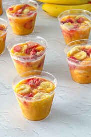 frozen fruit cups including bananas, mandarin oranges, pineapple, bananas, and strawberries