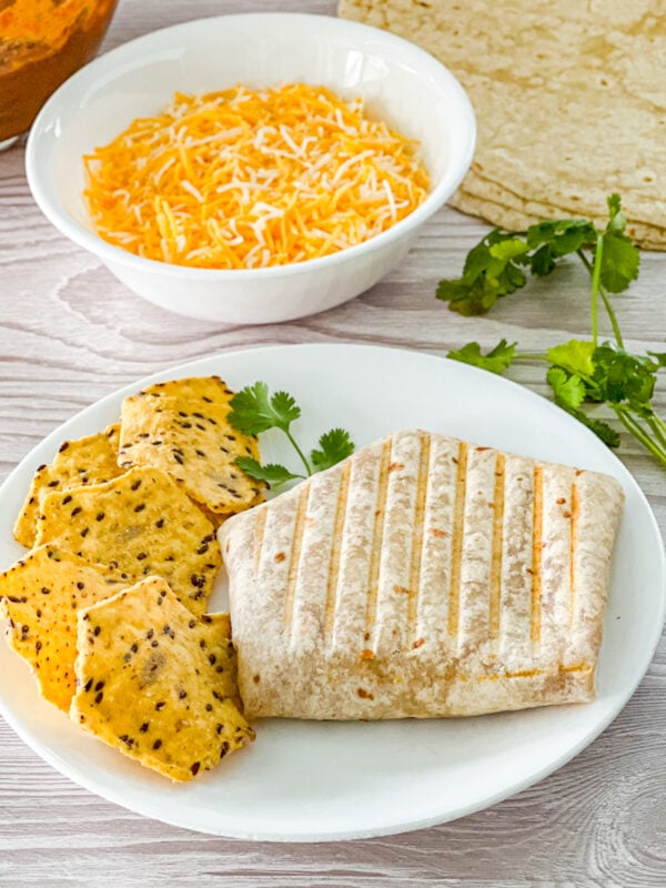 tortilla filled with cheese, chili, and refried beans