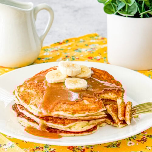 yummy yogurt pancakes with peanut butter syrup and banana slices