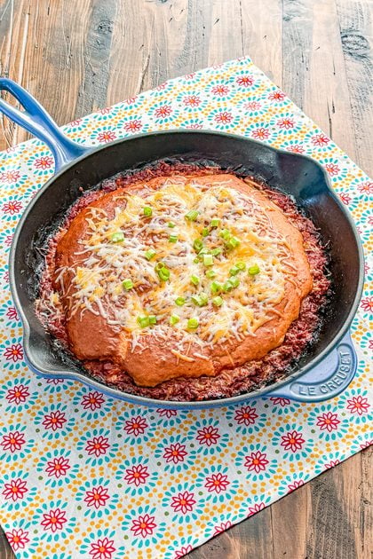 Skillet Sloppy Joe Pot Pie topped with melted cheddar cheese