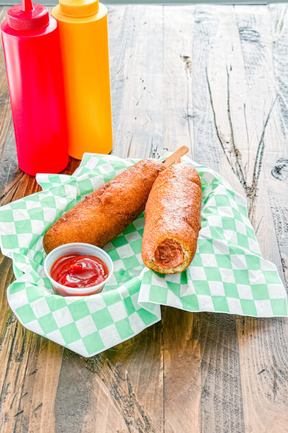 Inside of a homemade corn dog with fluffy cornbread batter and hot dog
