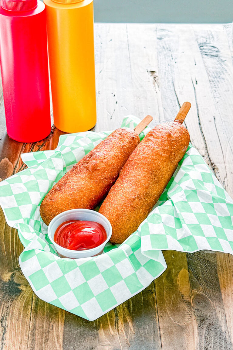Close-up of a homemade corn dog with golden cornbread coating