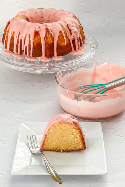 Shirley Temple Bundt Cake on a plate with full cake in the background