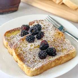 slices of buttermilk french toast on white plate