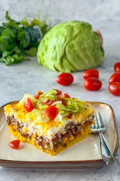 Cornbread Taco Bake topped with lettuce and tomato