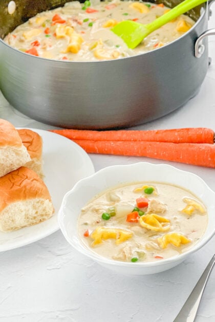 Creamy Chicken Tortellini Soup paired with rolls