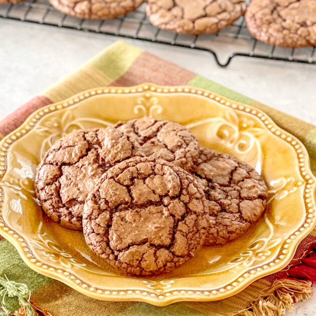 close up of Fudgy Brownie Cookies on yellow plate