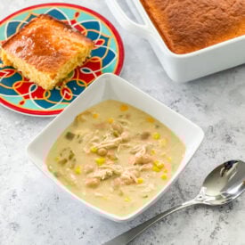 Green Chile Chicken Enchilada Soup In a white bowl