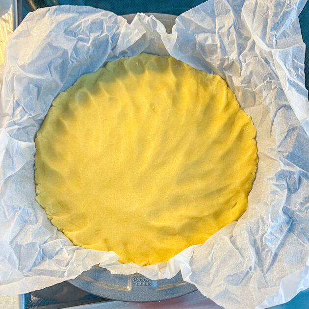 Sugar Cookie dough pressed into a 9 inch cake pan