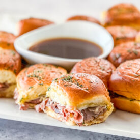 Close up of platter of French DIp Roast beef Sliders