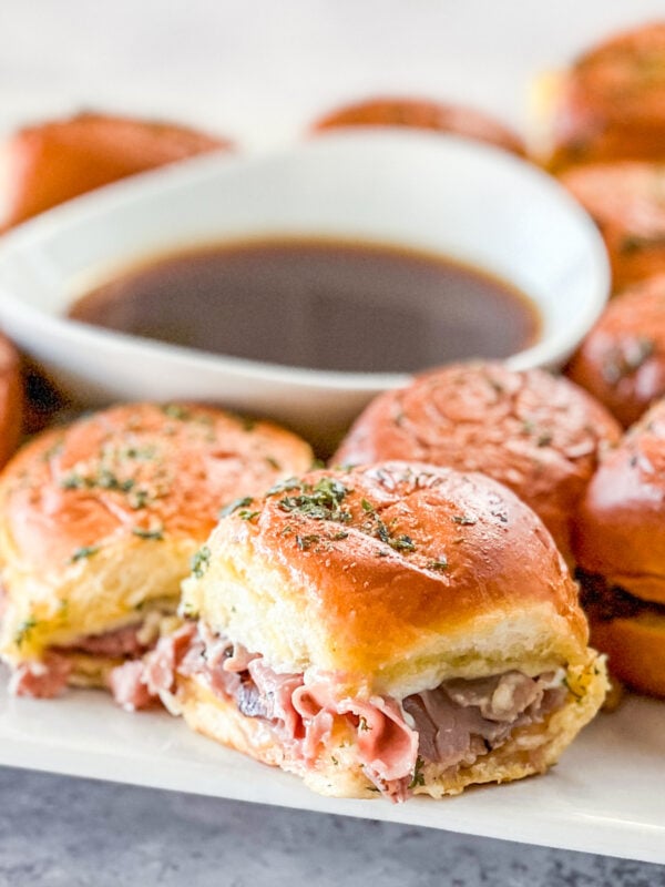 Close up of platter of French DIp Roast beef Sliders