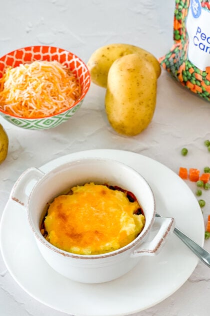 Ground Beef Cottage Pie in a bowl right out of the oven.