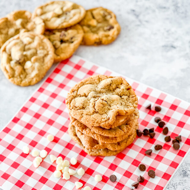 Stack of Mama Kelce's Chocolate Chip Cookies with pile of cookies in background