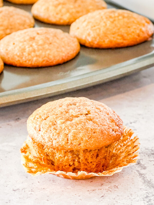 cinnamon banana muffin in unwrapped paper liner