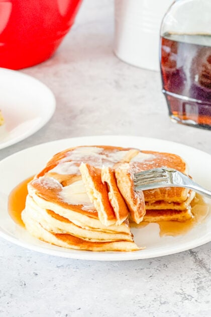 bite of stack of overnight buttermilk pancakes on fork