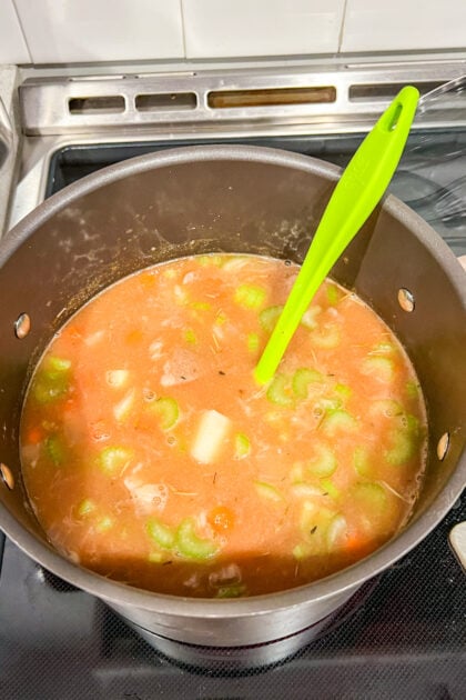 pot of beef stew as gets ready to simmer