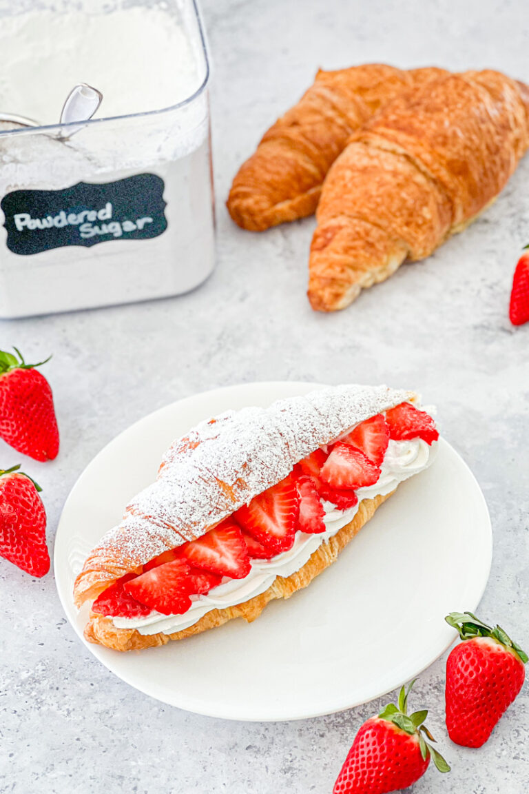 top view of strawberry shortcake croissant on white plate
