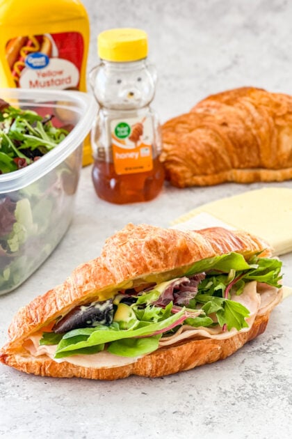 croissant sandwich with turkey, Havarti, and honey mustard sauce
