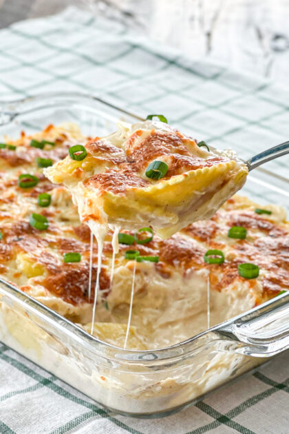 dishing up chicken alfredo pasta bake