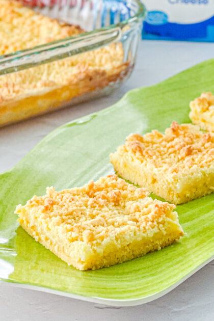 close uo of lemon cream cheese bars made with a cake mix