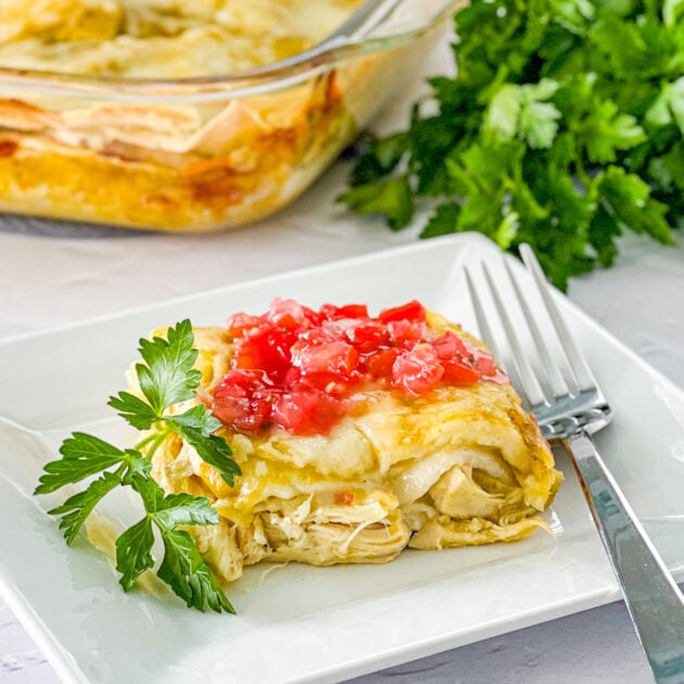 slice of layered chicken enchilada casserole