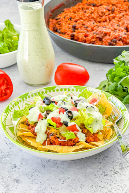 floating taco bowl with skillet in background