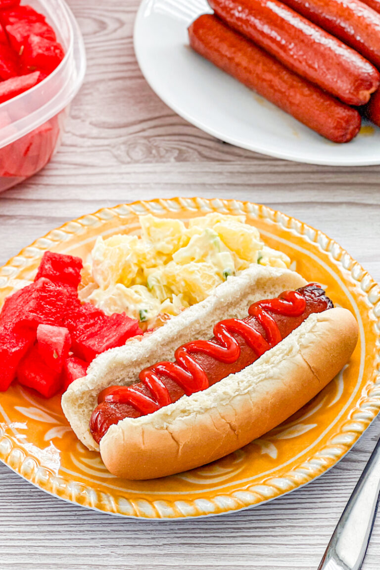easy smoked hot dog paired with potato salad and watermelon