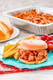 bbq smoked pullled chicken served as a sandwich