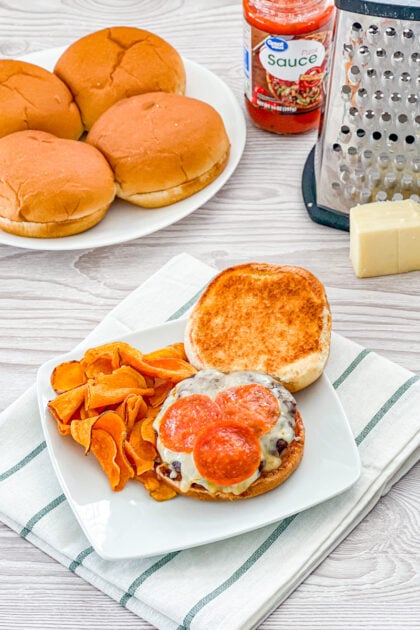 grilled burger topped with pizza sauce, mozzarella cheese, and pepperoni