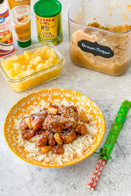 breaded chicken bites coated in pineapple ginger sauce