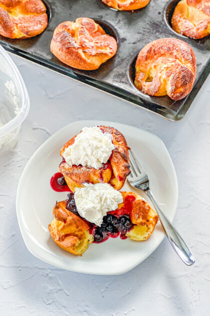 nun's puffs topped with homemade blueberry syrup and whipped cream