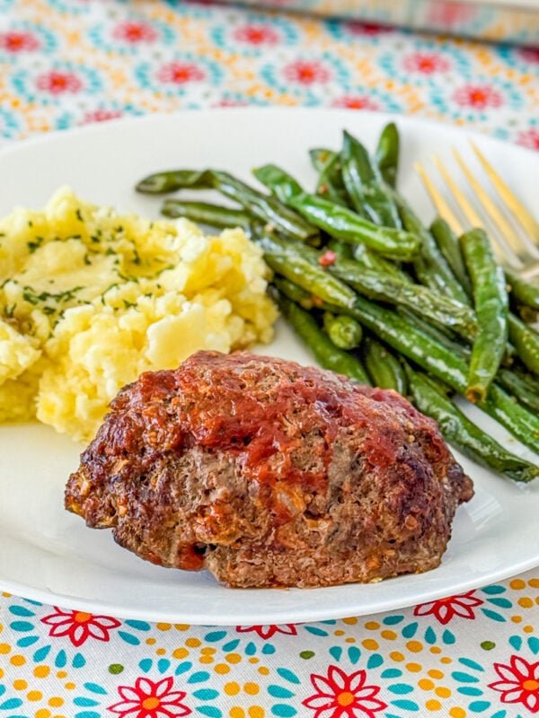 sheet pan meal with mini meatloaves, mashed potatoes, and green beans