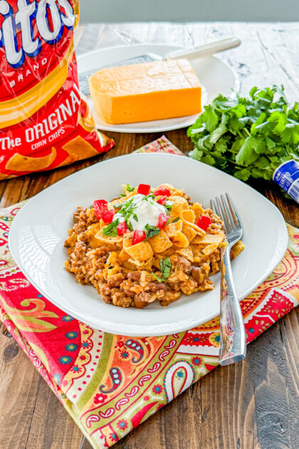 Hearty Instant Pot Frito Pie made with ground beef, rice, chili beans, and melted cheese.