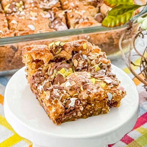 Brown butter Cadbury Egg cookie bars cut into squares with crushed Cadbury eggs on top