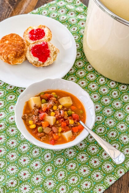 Cowboy soup with tender potatoes, ground beef, and mixed vegetables.