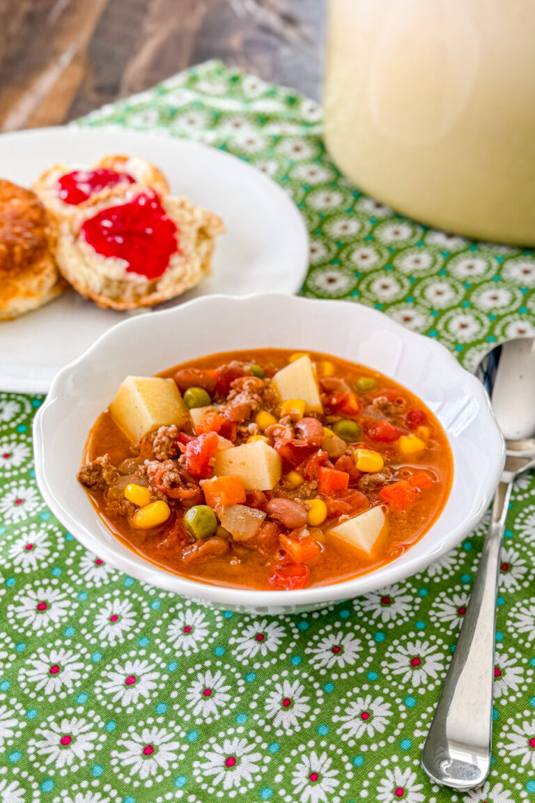 Cowboy soup with ground beef, beans, potatoes, and vegetables in a bowl.