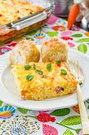 Hashbrown ham and egg casserole baked in a casserole dish and cut into squares