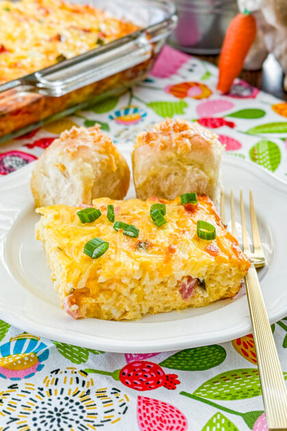 Hashbrown ham and egg casserole baked in a casserole dish and cut into squares