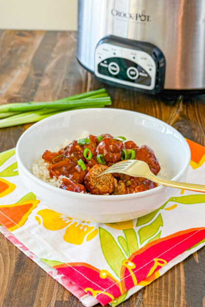 Slow cooker Hawaiian meatballs served over white rice