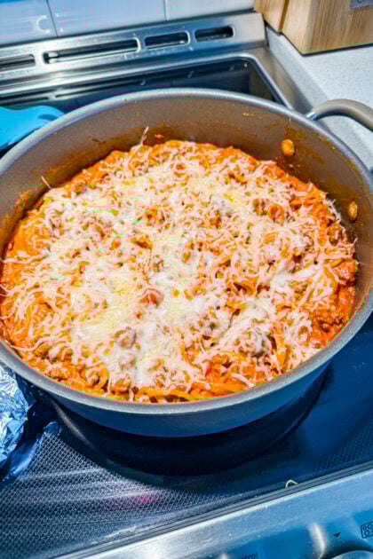 Creamy beef spaghetti finishing in the skillet