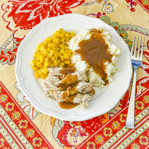 Instant Pot pork roast with gravy spooned over the top