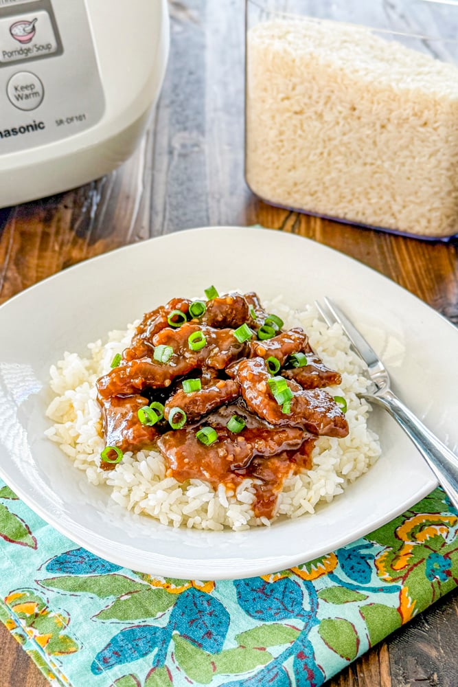 Better than takeout Mongolian beef with tender beef and green onions served over rice