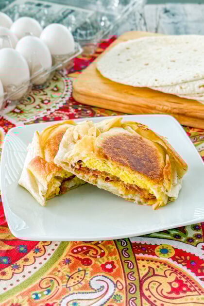Homemade Taco Bell copycat breakfast crunchwrap with eggs, bacon, cheese, and hash browns