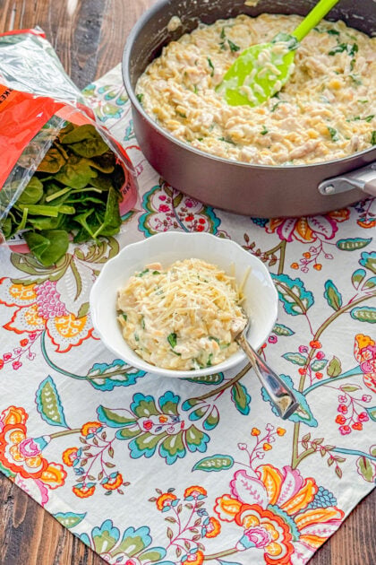 Creamy lemon chicken orzo skillet with chicken, spinach, and lemon