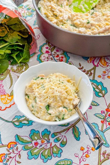 Overhead view of creamy lemon chicken orzo skillet in a bowl